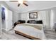 Cozy bedroom with a large bed, soft couch, and ample natural light streaming through the windows at 4044 56Th N Ave, St Petersburg, FL 33714