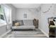 Neutral Bedroom with a convertible couch and grey patterned area rug at 4044 56Th N Ave, St Petersburg, FL 33714