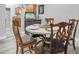 Dining room with rustic chairs, a table, and an aquarium in the corner at 4044 56Th N Ave, St Petersburg, FL 33714
