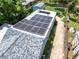 Aerial view of rooftop solar panels on a single Gathering home at 4044 56Th N Ave, St Petersburg, FL 33714
