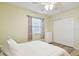 Bedroom with bright yellow walls, closet, and natural light coming from the window at 4108 Woodtrail Blvd, New Port Richey, FL 34653