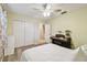 Bedroom with bright yellow walls, closet, a piano and natural light coming from the window at 4108 Woodtrail Blvd, New Port Richey, FL 34653