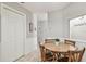 Cozy dining area with wooden table and wainscotting at 4108 Woodtrail Blvd, New Port Richey, FL 34653