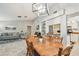 Open dining area connects the living room and kitchen, providing ample space for entertaining at 4108 Woodtrail Blvd, New Port Richey, FL 34653