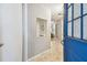 Bright entryway showcasing tile flooring and an open view of the living spaces at 4108 Woodtrail Blvd, New Port Richey, FL 34653