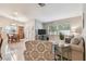 Cozy living room showcasing comfortable seating and a view into the dining area at 4108 Woodtrail Blvd, New Port Richey, FL 34653