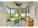 Relaxing screened-in porch with outdoor seating and views of the well-maintained yard at 4108 Woodtrail Blvd, New Port Richey, FL 34653