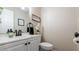 Stylish half bathroom with updated fixtures and a white vanity at 4207 Northwind Ln, Tampa, FL 33624