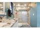 Updated bathroom showcasing a glass-enclosed shower, sleek fixtures, and a modern vanity at 4207 Northwind Ln, Tampa, FL 33624