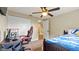 A bedroom decorated with a single bed, computer, monitor and gaming chair at 4207 Northwind Ln, Tampa, FL 33624