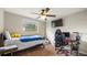 A bedroom decorated with a single bed, computer, monitor and gaming chair at 4207 Northwind Ln, Tampa, FL 33624
