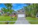 Charming two-story home with a well-maintained lawn, brick accents, and inviting curb appeal at 4207 Northwind Ln, Tampa, FL 33624