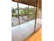 Covered balcony with views of greenery and parking for the complex at 4207 Winding Moss Trl # 201, Tampa, FL 33613