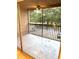 Private balcony with a ceiling fan and exterior green tree scenery at 4207 Winding Moss Trl # 201, Tampa, FL 33613