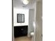 Bathroom with vanity, black cabinet, white countertop, and neutral tile flooring at 4207 Winding Moss Trl # 201, Tampa, FL 33613