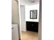 Bathroom featuring a vanity, mirror, and neutral tile flooring at 4207 Winding Moss Trl # 201, Tampa, FL 33613