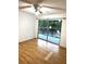 Inviting bedroom featuring a sliding glass door leading to a balcony with natural light at 4207 Winding Moss Trl # 201, Tampa, FL 33613