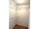 Walk-in closet with wire shelving for organized storage and a clean, minimalist design at 4207 Winding Moss Trl # 201, Tampa, FL 33613