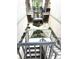 View of the complex courtyard showing landscaping and metal stairs at 4207 Winding Moss Trl # 201, Tampa, FL 33613