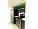 Updated kitchen showcases stainless steel appliances and dark cabinets, perfect for modern living at 4207 Winding Moss Trl # 201, Tampa, FL 33613