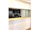 The kitchen view highlights stainless steel appliances and a breakfast bar opening to living area at 4207 Winding Moss Trl # 201, Tampa, FL 33613