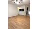 Open concept room with hardwood flooring and partial kitchen view at 4207 Winding Moss Trl # 201, Tampa, FL 33613
