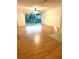 Spacious living room featuring a sliding glass door with beautiful laminate flooring at 4207 Winding Moss Trl # 201, Tampa, FL 33613