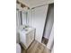 Bathroom featuring a modern vanity with stone countertops and updated fixtures at 4415 Tuna Dr, Tampa, FL 33617