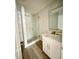 Bathroom featuring a modern vanity with stone countertops and updated fixtures at 4415 Tuna Dr, Tampa, FL 33617