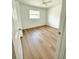 Bright bedroom featuring hardwood flooring and natural lighting at 4415 Tuna Dr, Tampa, FL 33617