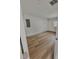 Bedroom with white walls and modern wood flooring at 4415 Tuna Dr, Tampa, FL 33617