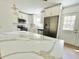 Modern kitchen features quartz countertop island, stainless steel appliances, and sleek white cabinetry at 4415 Tuna Dr, Tampa, FL 33617
