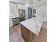 A modern, open-concept kitchen with stainless steel appliances and a stylish island at 4415 Tuna Dr, Tampa, FL 33617