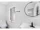 Clean bathroom features a sink, mirror, and toilet at 4925 Alcazar S Way, St Petersburg, FL 33712