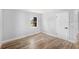 Bright bedroom features wood-look flooring, fresh neutral walls and access to the en suite bathroom at 4925 Alcazar S Way, St Petersburg, FL 33712