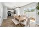 Bright dining area with stylish table, bench, and sliding glass door at 4925 Alcazar S Way, St Petersburg, FL 33712