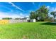 Expansive backyard with a white storage shed, ideal for relaxation and entertainment at 4928 Timber Way, Zephyrhills, FL 33542