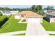 Charming single-story home with a well-manicured lawn and a two-car garage at 4928 Timber Way, Zephyrhills, FL 33542