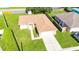 Charming single-story home with a well-manicured lawn, attached garage, and cozy curb appeal at 4928 Timber Way, Zephyrhills, FL 33542