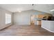 Bright, open living room featuring wood floors and neutral paint scheme at 4928 Timber Way, Zephyrhills, FL 33542