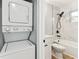 Modern bathroom with stylish tile, and a stacked washer and dryer at 508 38Th N Ave, St Petersburg, FL 33704