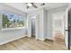 Bright bedroom with laminate floors, closet, and an adjacent room at 508 38Th N Ave, St Petersburg, FL 33704