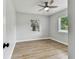 Serene bedroom featuring laminate floors, ample natural light, and ceiling fan at 508 38Th N Ave, St Petersburg, FL 33704