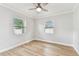 Bright bedroom with hardwood floors, ceiling fan, and dual windows at 508 38Th N Ave, St Petersburg, FL 33704
