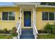 Welcoming front door featuring a stylish wreath and fresh landscaping at 508 38Th N Ave, St Petersburg, FL 33704