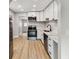 Renovated kitchen with stainless steel appliances and white cabinets at 508 38Th N Ave, St Petersburg, FL 33704