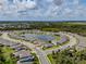 Aerial view of home in the community with pond views and well-manicured landscaping at 5329 Senza Trl, Palmetto, FL 34221
