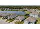 An aerial view of a residential area with a lake in the middle at 5329 Senza Trl, Palmetto, FL 34221