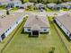 Aerial view of a home with a fenced backyard and lush green lawn at 5329 Senza Trl, Palmetto, FL 34221