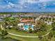 Community features pool and amenities nestled among lush landscaping and scenic water views at 5329 Senza Trl, Palmetto, FL 34221
